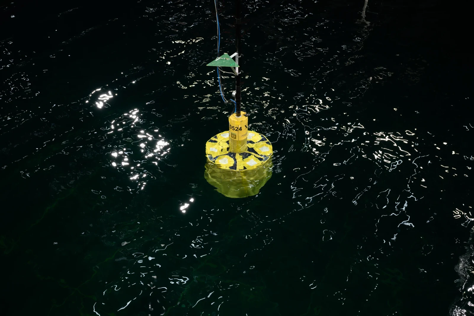 Yellow ECO TLP foundation scale model for the 15 MW turbine configuration, with instrumentation in the MARIN test basin.